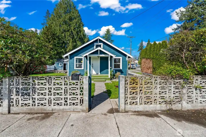 From street, classic cememnt fence