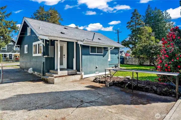 back yard with extra parking or working area.