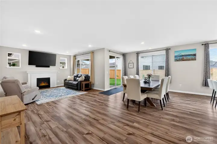 Easy access to the fully fenced backyard with covered patio.
