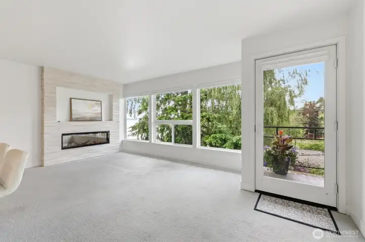 Living room with fireplace and view of Lake Washington