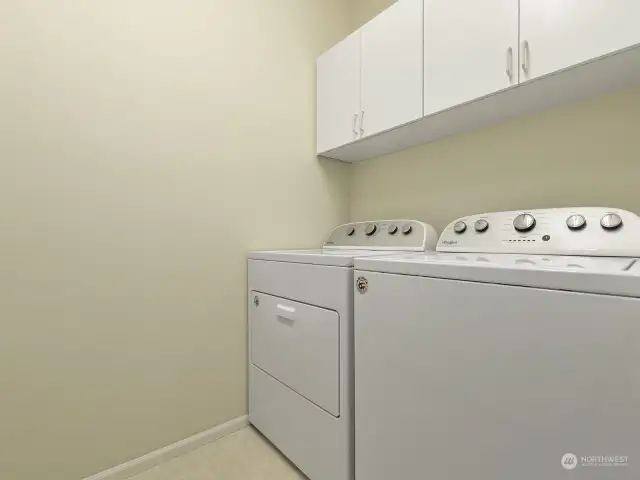 The main level laundry room comes complete with the washer and dryer.
