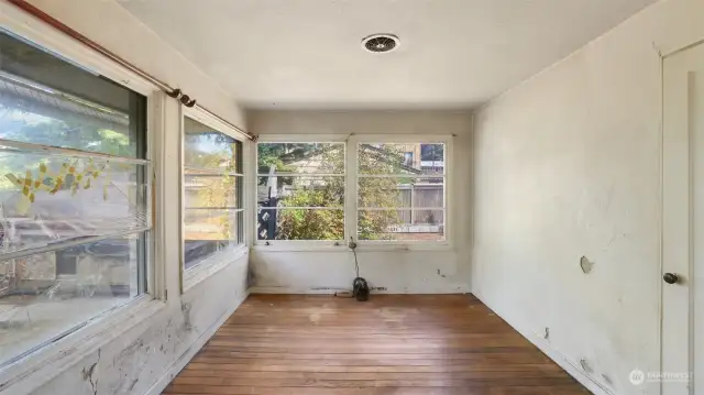 Second bedroom surrounded by windows is great as is or even bump out the home a bit to create a large primary suite and add a second bathroom here.