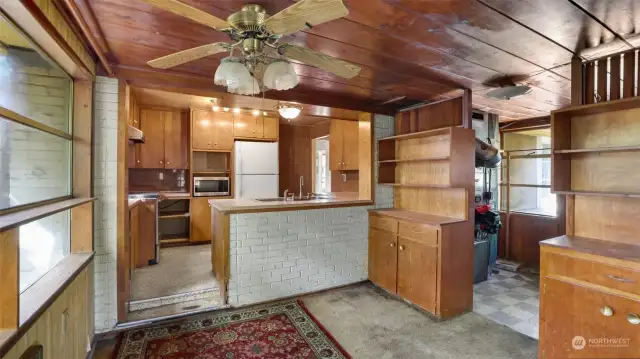 You will feel like you've stepped back in time here with wood paneling throughout most of the kitchen and dining space.