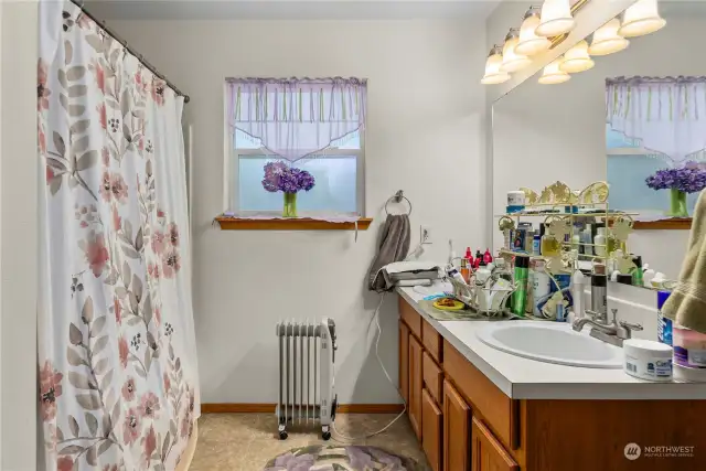 Primary bath includes double sinks and a soaking tub.