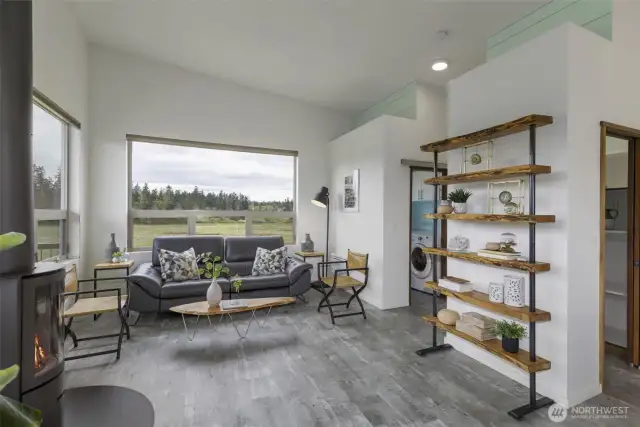Cozy living room anchored by a modern wood-burning stove and custom built-ins.
