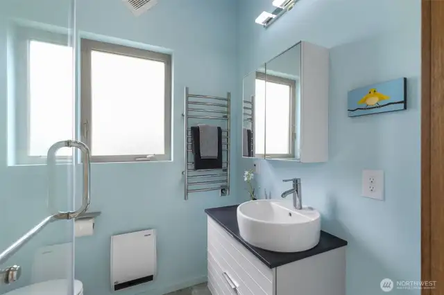 Bright, fresh second bath with a clean coastal color palette and modern design.
