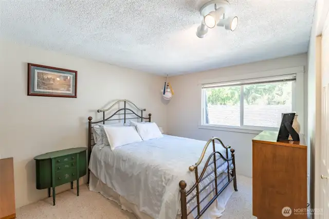 Second bedroom with a window looking toward the back of the property.