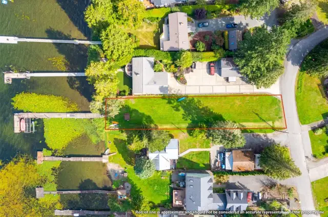 Don't miss the lake access lot, just across the street. Big grassy field and dock with multiple boat slips. This home includes partial ownership in the lakefront lot!
