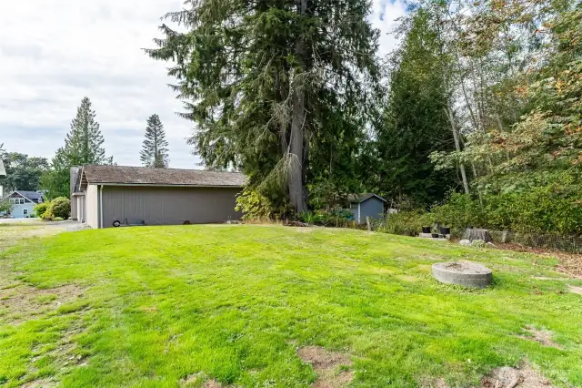 Large backyard waiting for your projects and ideas. Plenty of room for a garden, play area, fire pit and more.