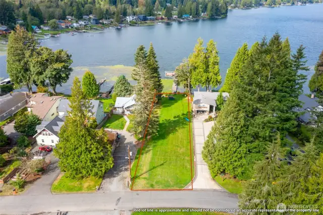Huge grassy field and dock are all part of the shared ownership that comes with this lot - with no HOA's or dues!