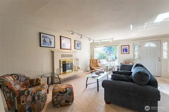 Large living room with picture windows to let in the light and enjoy the view.
