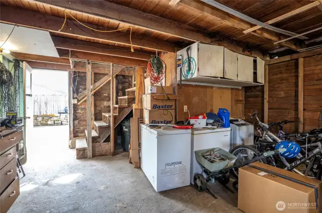 Shop stairs to unfinished space.