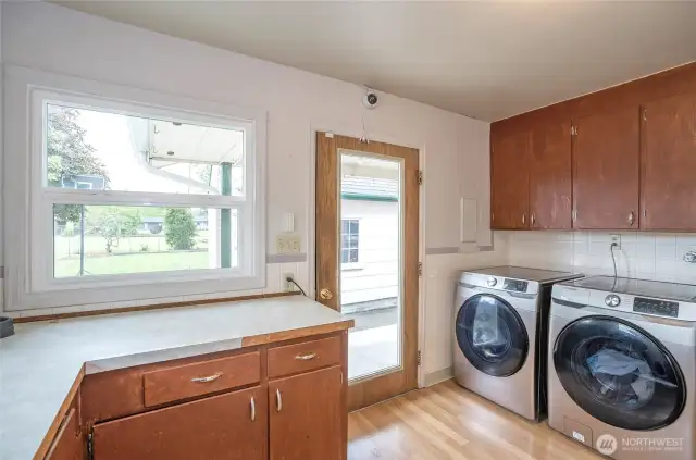 Laundy room, and the back door to the house.