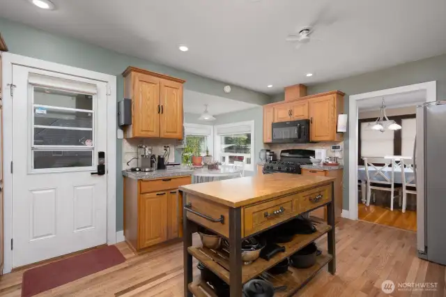 Door on left of photo goes to covered porch/mud room. Door on right to dining room.