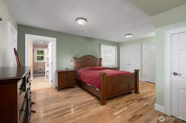 Main floor -- primary bedroom. Door on left side of photo goes to primary bath and laundry area