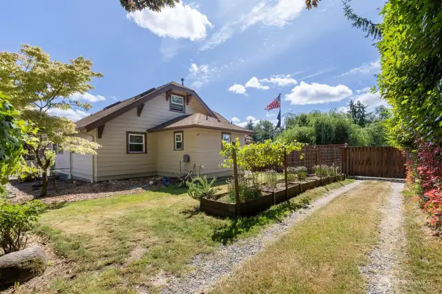 This is the secondary driveway off of Golden Given that gives access to the back yard. One can also enter from the very back of the property.
