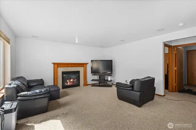 Large family room with gas fireplace.