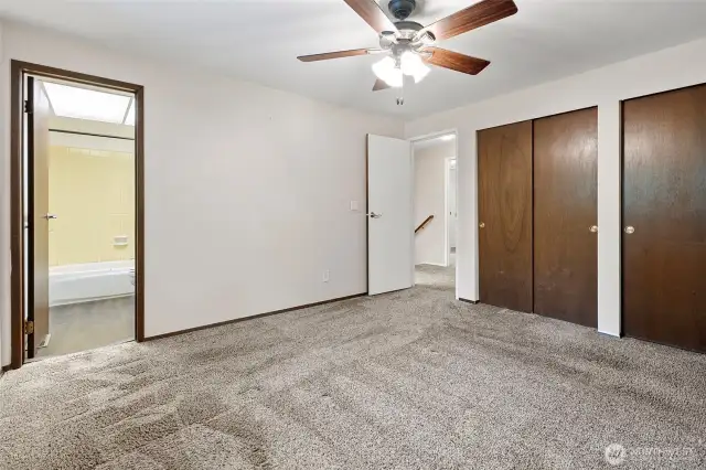 Primary suite boasts full en-suite bathroom and his and hers closets
