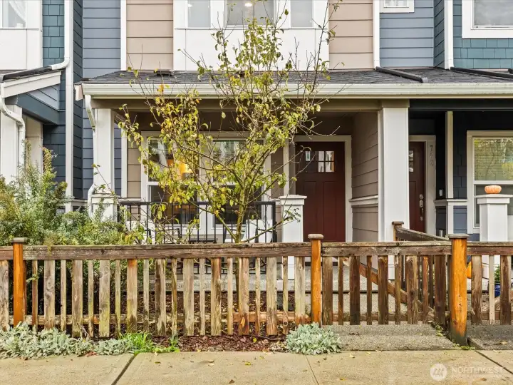 East facing with attached garage in back.
