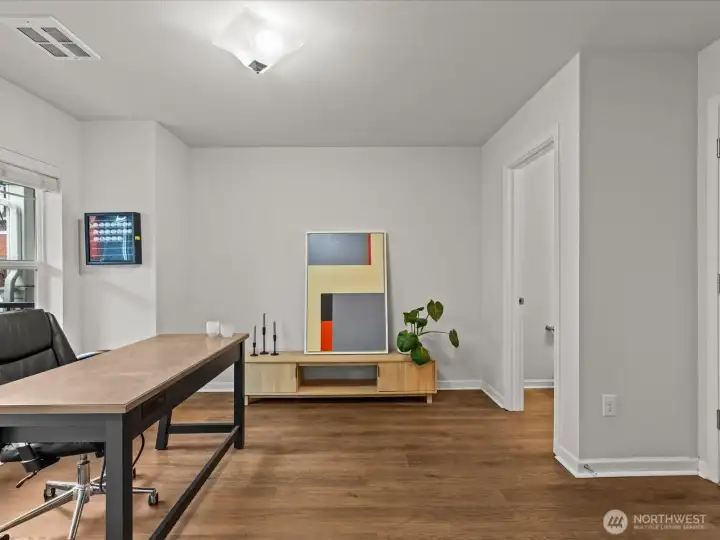 Ground level open room is perfect for a home office or flex space.