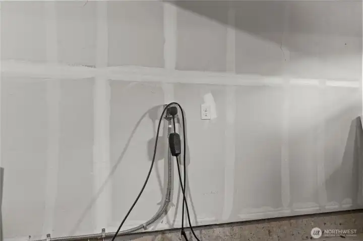 Recently installed Ev charger in the private, attached garage.