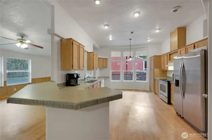 The spacious kitchen, the bay window are at the end can also be a nice dining area.