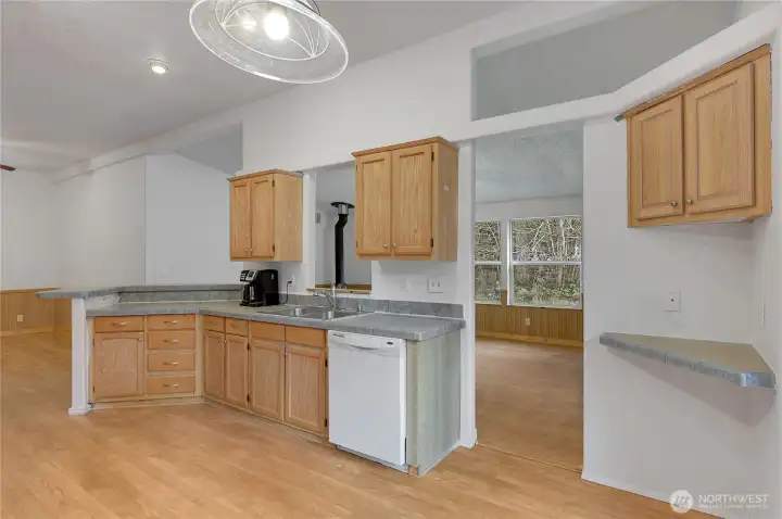 The sink area has a nice pass-through window so you can be in touch with everybody in the living room.