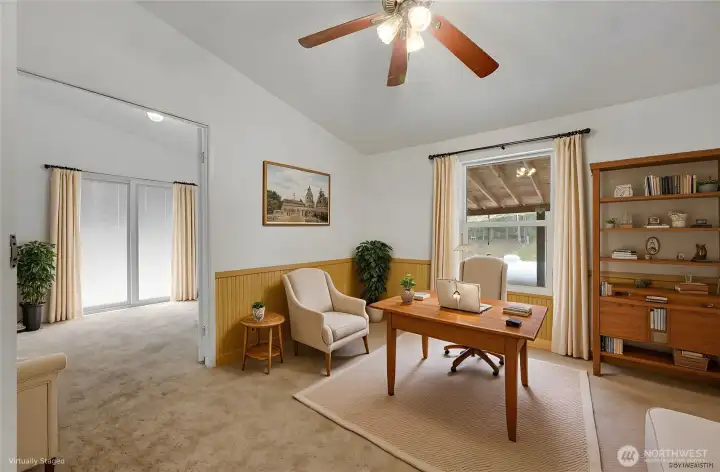 You will love this office the doors on the left opens to an additional bonus room. It is virtually staged.