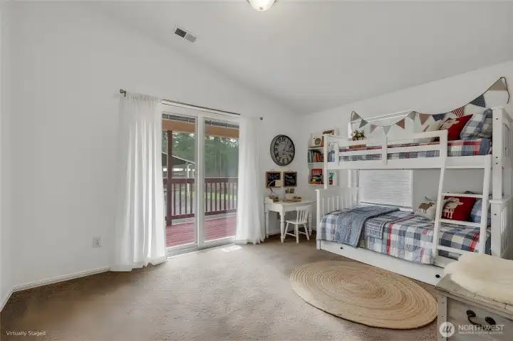 This is the bonus room adjoining the office area, it is virtually staged.