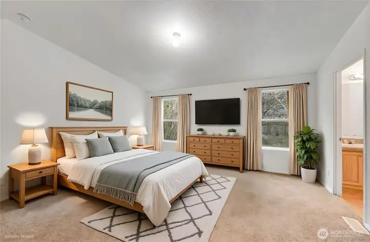 The primary suite is a wonderful retreat. It is virtually staged.