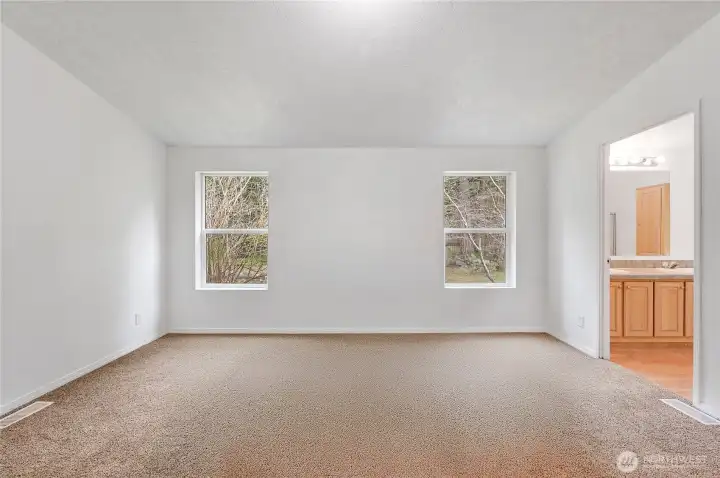 The primary suite not staged. The carpet in both bedrooms, office and bonus rooms all have new carpet.