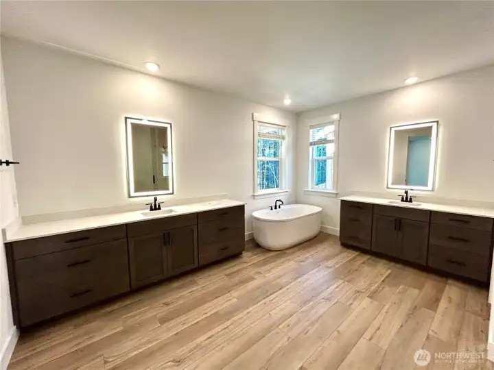 Primary bath with a ton of counter space that is separated.