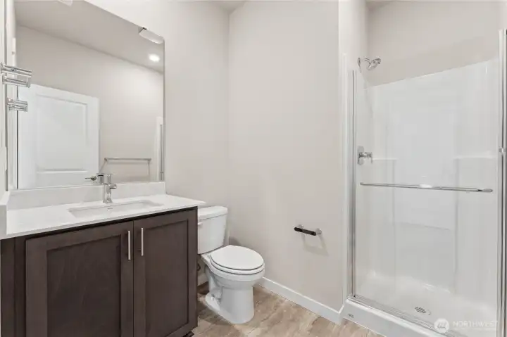 Main level 3/4 bath.Photo's are for representational purposes only. Colors and finishes may differ.