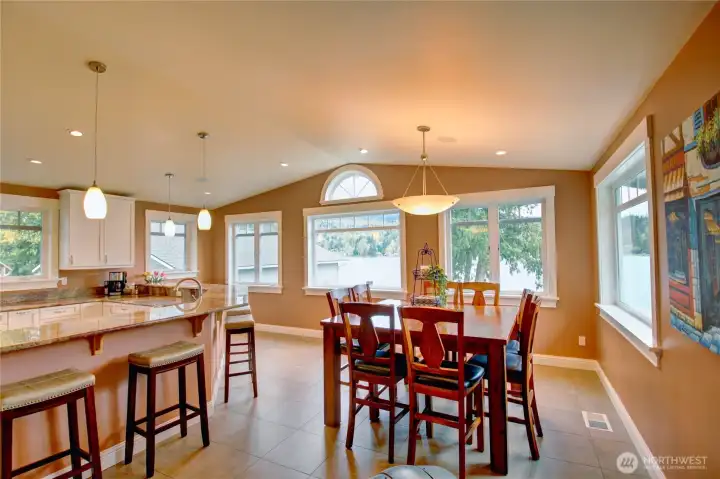 Spacious kitchen with panoramic lake views and plenty of space to for everyone to gather to enjoy.