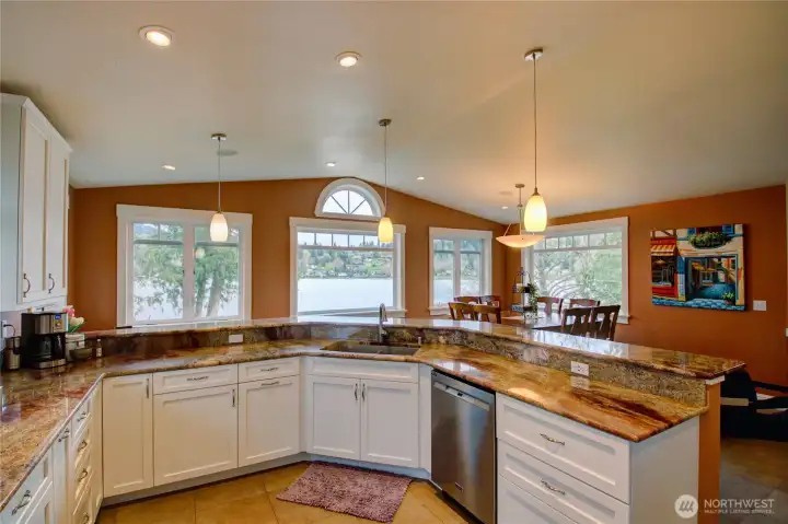 Kitchen offers abundant workspace with beautiful granite counters. Two separate sinks and a circulating pump for instant hot water.