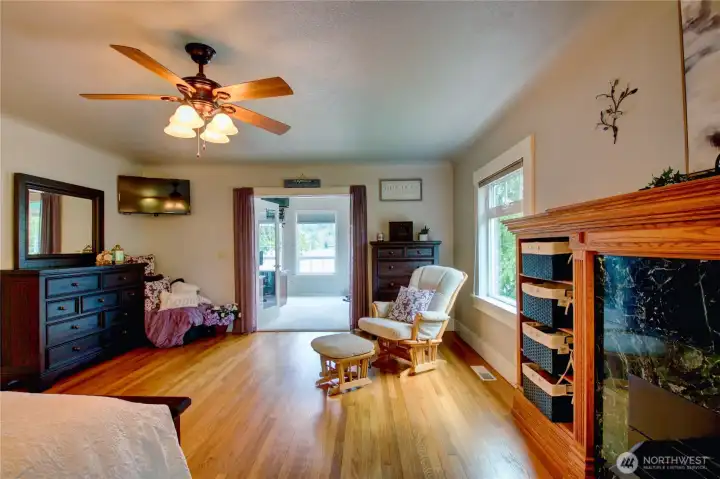 Primary bedroom on main is a true retreat. Relax by the fireplace with built cabinetry, flawless wood floors and gorgeous original character of the home with coved ceilings.
