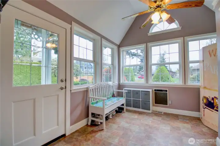Main floor entry offers wonderful nook to enjoy morning sun. There is a large closet to keep everything you need to head out for the day.
