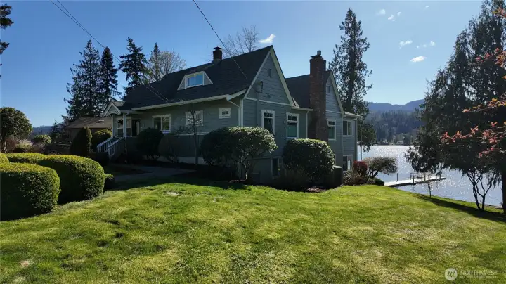 View from north corner of the property. Large yard with mature lanscaping.