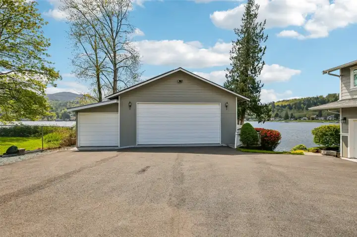 An expansive 40’x38’ shop -Ample covered storage vehicles, boats & water toys. Workshop with a wood stove. New Solar panels (owned) on shop - offering significant energy savings. $0-low power bills.