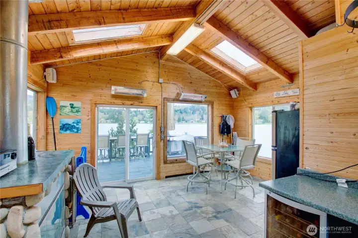 The Lakeside Gazebo is ideal for fun filled days on the lake. With low maintenance slate floors and cedar paneling makes a perfect place to gather  on the lake. Equipped with 3/4 bathroom, gas fireplace, electric heaters, counter space, wine fridge, Full refrigerator, cook top and extra storage.