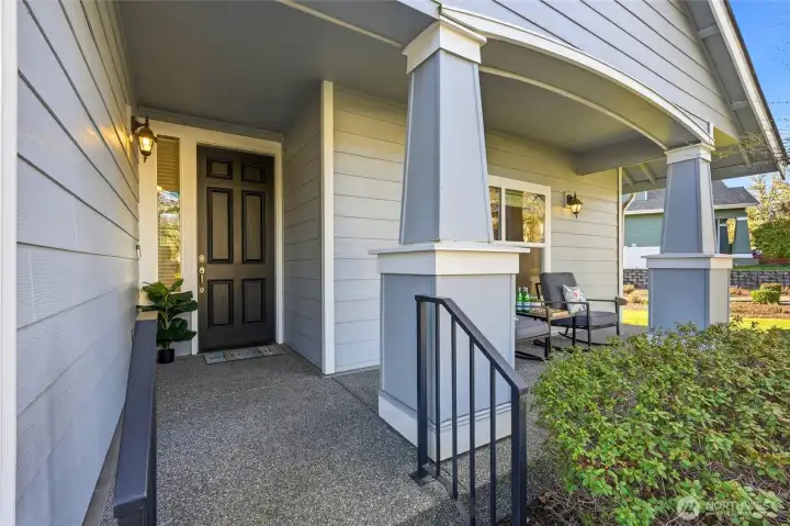 Enjoy morning coffee or evening relaxation on the covered front porch.