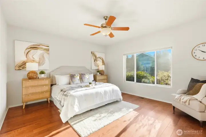 Spacious primary suite provides a peaceful retreat at the end of the day.