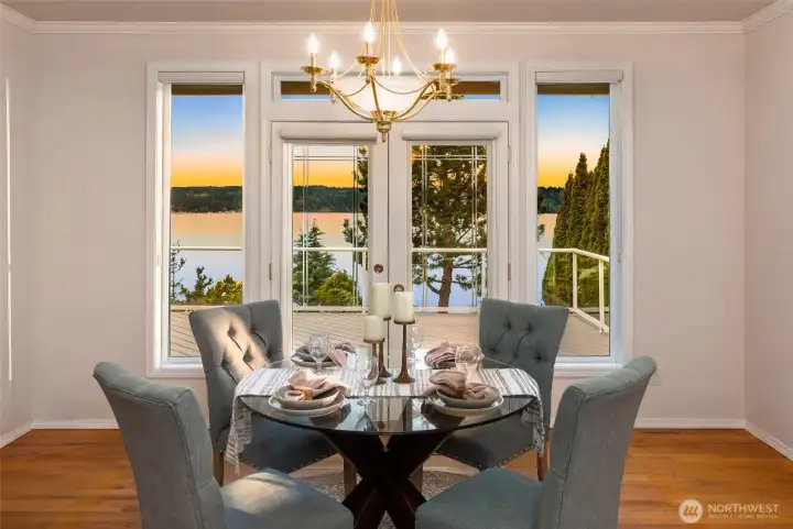 Dining Room — A Beautiful Setting for Entertaining with Water Views and French Doors Opening to the Deck