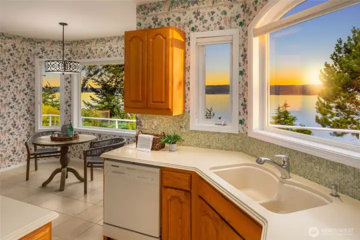 Kitchen with Window-Wrapped Eating Nook and Water Views