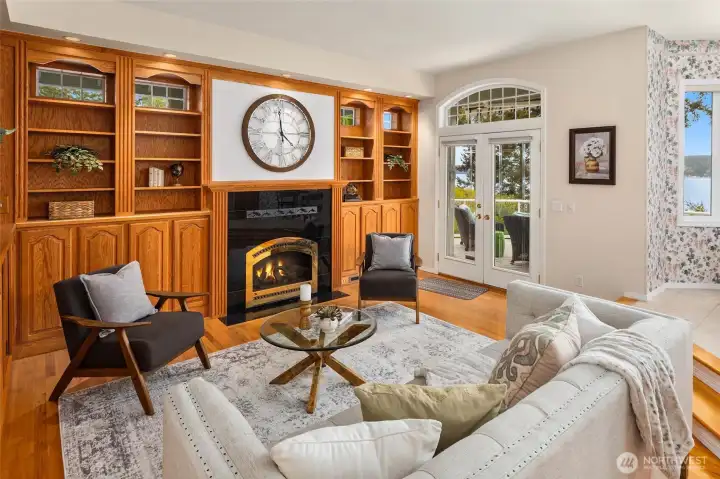 Inviting Family Room — Custom Built-Ins with French Doors Opening to the Wraparound Deck