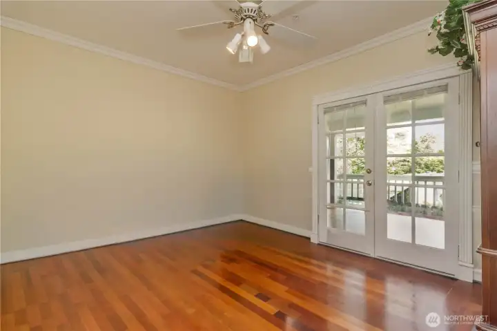 Main floor den/office featuring impressive Brazilian cherry hardwood floors and elegant French doors.
