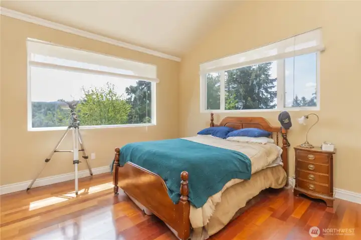 Picture windows fill the guest suite #1 with natural light, creating a bright and inviting space.