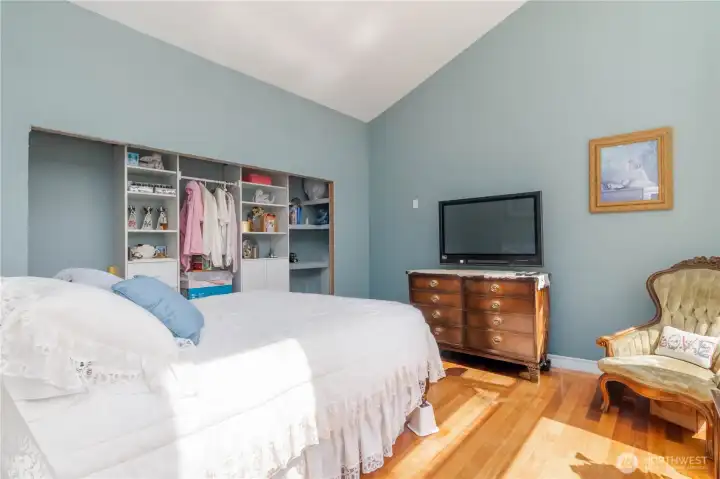 Guest suite #2 featuring vaulted ceilings and abundant natural light, creating a bright and airy feel.