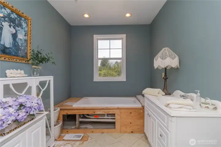 Unfinished bathroom off guest suite #2 with soaking tub, ready for your finishing touches.