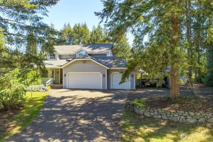 Ample parking with 3 car garage and carport